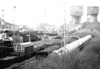 A long lens view south over the down side of Millerhill marshalling yard from Whitehill Road on 22 April 1980, with Monktonhall Colliery dominating the background.<br><br>[John Furnevel 22/04/1980]