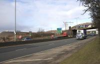 The M8 extension railway viaduct construction site south of the Whifflet line on 23rd March 2015. Temporary embankments have been constructed on both sides of the railway to facilitate piling work.<br><br>[Colin McDonald 23/03/2015]