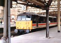 BR InterCity liveried 86233 <I>'Sir Laurence Olivier'</I> stands at Carlisle platform 3 in March 1993, having recently arrived with a train from the south.<br><br>[John Furnevel 03/03/1993]