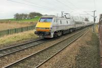 91108 propels an ECML service south at speed passing Castle Hills Junction. This image was taken from a train on the adjacent reversing line. The <I>Wensleydale and Durham Coast</I> excursion had visited the Wensleydale Railway and was waiting to rejoin the main line.  For a view from the other side of the train at this location [See image 50809].<br><br>[Mark Bartlett 21/03/2015]