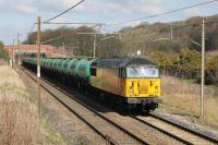 A Grangemouth (Ineos) to Long Marston special working of 27 aviation fuel four wheel tankers ran on 25th March 2015. The wagons, presumably bound for storage, are seen here passing Woodacre behind Colas 56113. [Any information on the background to this working would be appreciated.] <br><br>[Mark Bartlett 25/03/2015]