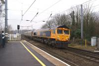 GBRF 66751 hauls a rake of coal wagons off the viaduct at the south end of Durham station heading for Tyne Dock on 16 March 2015<br><br>[John McIntyre 16/03/2015]