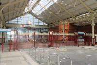 Llandudno station has undergone a high quality restoration in recent years with many of the original features being retained alongside modern improvements. This is the view from the buffer stops towards the booking hall in March 2015.  <br><br>[Mark Bartlett 16/03/2015]