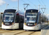 Edinburgh trams pass at Gyle Centre on 25 March 2015.<br><br>[Colin Miller 25/03/2015]