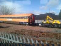 An Irish Rail carriage in the yard at Brodie's, Kilmarnock, on 31 March 2015 awaiting conversion as part of the <I>'Belmond Grand Hibernian'</I> luxury train, due to launch in 2016.<br><br>[John Yellowlees 31/03/2015]