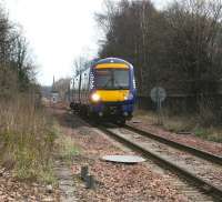 The 1341 Alloa - Glasgow Queen Street has just passed Alloa West loop and is approaching Cambus level crossing on 31 March 2015. The spire of St Mungo's church is prominent in the background.  [see image 12786]<br><br>[John Furnevel 31/03/2015]