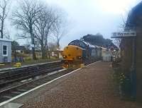 Topped and tailed with 37s a Network Rail train heads north across the level crossing into Forsinard station.<br><br>[Rod Crawford 31/03/2015]