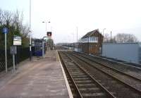 Looking south over the level crossing at Heighington towards Darlington on 18 March 2015. A new REB has appeared on the right next to the signalbox and new LED signals protect the crossing.<br><br>[John McIntyre 18/03/2015]