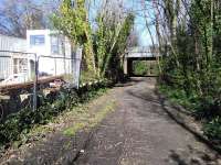 Business premises occupy the down platform of the former Merchiston station which closed with the line between Edinburgh Princes Street and Slateford Junction in 1965. The platform edges have gone, but the surviving supports still stand proud in 2015.<br>
<br><br>[David Panton 05/04/2015]