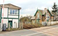 The operational signal box at Croes Newydd North Junction, just south of Wrexham General station, and an old railway cottage by the level crossing. This was where the long closed line to Brymbo left the main line and 89C Croes Newydd steam shed sat in the triangle of lines between North, South and West Junctions.<br><br>[Mark Bartlett 15/03/2015]