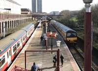 View east from the station entrance at Bellgrove in February 2005, with trains for Airdrie and Balloch at the platforms. <br><br>[John Furnevel 19/02/2005]