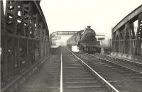 V3 67643 about to leave Anniesland station and cross the bridge over Great Western Road on 13 April 1957. The train is a Helensburgh Central - Bridgeton Central service.  <br><br>[G H Robin collection by courtesy of the Mitchell Library, Glasgow 13/04/1957]