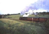 Standard Class 5 4-6-0 73106 climbing to Hairmyres on 29 May 1965 with empty stock for East Kilbride. <br><br>[John Robin 29/05/1965]