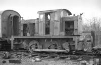 McMullen Bros scrapyard alongside Gartsherrie South Junction in November 1977. The loco is John Fowler 0-4-0DM 4200025 of 1948, originally supplied to Boots Pure Drug Co., Airdrie, then Tunnel Portland Cement Co Ltd., Gartsherrie. [Ref query 1636] <br><br>[Bill Roberton /11/1977]