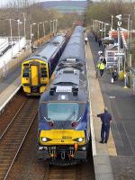 DRS 68004 on the 17.08 from Edinburgh meets 158732 heading in the opposite direction at Rosyth, on 8 April 2015.<br><br>[Bill Roberton 08/04/2015]