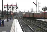 Up postal running south through Stirling station on a wet and gloomy (note the platform lights are on) January day in 2005 behind an unidentified EWS class 67 locomotive.<br><br>[John Furnevel 12/01/2005]