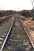 A 1997 view east from a foot crossing towards Deighton Junction along the mothballed spur running from Bradley Junction, that forms a triangle with the former LNWR line to Huddersfield and the former L&Y Calder Valley line. The line re-opened in 2000 to link with the opening of the new Brighouse Station and creation of a new service using the line between Huddersfield and Halifax<br><br>[David Pesterfield 03/07/1997]