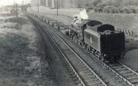 BR Standard class 5 73063 heads down the Switchback past Kennyhill Goods on 28 May 1958 with a train of low loaders.<br><br>[G H Robin collection by courtesy of the Mitchell Library, Glasgow 28/05/1958]