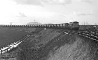 On the afternoon of 5 February 1970, BRCW Type 2 No. 5303 approaches Monktonhall Junction off the chord from Millerhill Yard with a loaded MGR coal train from Monktonhall Colliery (booked departure time 16:05) to Cockenzie Power Station. The tracks on the extreme right were the direct connection from Niddrie West Junction via Wanton Walls.<br><br>[Bill Jamieson 05/02/1970]
