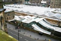 <I>'Window cleaner wanted - must have large bucket'</I>. View north west over Market Street towards Princes Street on 14 April 2015 showing part of the glass canopy covering the station.<br><br>[John Furnevel 14/04/2015]