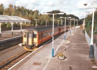 In October 1997 a Newcastle To Glasgow service pulls into Dumfries on 10 October 1997. The daily orange train would a have been a more unusual sight south of the border.<br>
<br><br>[David Panton 10/10/1997]