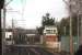 Deansgate Junction signal box, as seen from a Manchester bound tram. The box controls trains and trams between here and Altrincham including frequent movements over the level crossings here and at Navigation Road. The line to Stockport and Chinley can be seen curving right just beyond the box, which was extended when Metrolink opened but is scheduled to close in 2019. <br><br>[Mark Bartlett 13/01/2015]