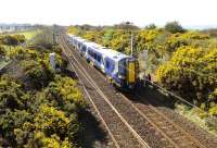 The 10.36 Ayr - Glasgow Central about to pass the site of Monkton Station, just north of Prestwick, on 16 April 2015. Monkton station closed to passengers in 1940.<br><br>[Colin Miller 16/04/2015]