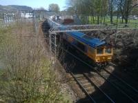 Taking the Helensburgh route from Dalreoch, 66736 heads the Alcan tanks towards the West Highland line and Fort William.<br><br>[Malcolm Chattwood 21/04/2015]