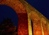 North Water Bridge Viaduct viewed from its west side. In the mid 90s illuminating the bridge at night was considered by the council. This photograph was taken during a trial of the idea with streetlights and a generator.<br><br>[Ewan Crawford //1995]