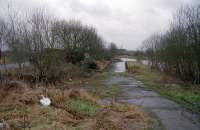 View west at Kirkintilloch's Middlemuir Basin slipway. This was before reinstatement of a basin at Kirkintilloch with the re-opening of the canal. The new dock has a different footprint to the original which had two basins. The Monkland and Kirkintilloch Railway terminated at the basin which was located to the left. The slipway shown here has received a huge makeover.<br><br>[Ewan Crawford //2001]