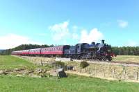 Ivatt Class 2 No.46512 passes the site of Broomhill Junction on the Strathspey Railway on 11 April 2015 with the early afternoon train for Broomhill. <br><br>[John Gray 11/04/2015]