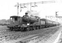 Preserved ex-North British 4-4-0 no 256 <I>Glen Douglas</I> approaching Shettleston on 30 April 1960 with the SLS Scottish Area <I>'Glasgow City and District Railtour'</I>.<br><br>[G H Robin collection by courtesy of the Mitchell Library, Glasgow 30/04/1960]