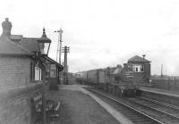 An unidentified 2P 4-4-0 passing through Gatehead station on 29 July 1953 with a Kilmarnock - Ayr train. [Ref query 6590]<br><br>[G H Robin collection by courtesy of the Mitchell Library, Glasgow 29/07/1953]