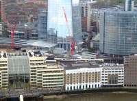 South Eastern services from the west running into London Bridge on 25 April 2015 passing The Shard. The red cranes are for the ongoing rebuilding of London Bridge Station.<br><br>[John Thorn 25/04/2015]