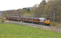 A gleaming rake of MkI stock from Carnforth rolls south at Brock behind DBS 66122 heading for Wembley on 27 April. The 11 coaches in this ECS movement (and the loco) were required for the <I>GBVIII</I> tour the following day, hauled by 70000 <I>Britannia</I>. [See image 51120]  <br><br>[Mark Bartlett 27/04/2015]