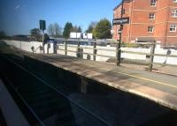 A grab shot from a train to Hereford on 18 April 2015, showing how the new Bromsgrove station is being built South of the current platforms. This will minimize the distance from the new car parks to the platforms, but will also allow stopping Northbound trains to gather some speed before getting stuck into - or on! - the Lickey Incline. [see image 47025]<br><br>[Ken Strachan 18/04/2015]