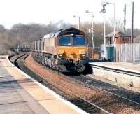 An exceptionally hot day in the west of Scotland on 4 April 2007 sees EWS 66090 negotiating the reverse curves through Kirkwood with coal from Hunterston import terminal bound for Longannet power station.<br><br>[John Furnevel 04/04/2007]