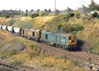 20223 and 20222 climb towards Craiglockhart Junction on the Edinburgh 'sub' with a southbound MGR coal train in 1982.<br><br>[Bill Roberton //1982]