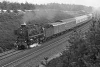 With just a few weeks to go before the last 012 oil-fired Pacifics based at Rheine were withdrawn, 012 075 roars through the cutting north of Lathen (one of the few distinctive topographical features on the Emsland line) in May 1975 with train E3260, 07:50 Norddeich - Rheine.<br><br>[Bill Jamieson 10/05/1975]