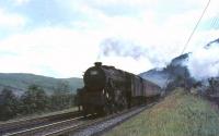 Newton Heath Black 5 44696 photographed on 31 July 1965 just north of Greskine. The train is being banked by Beattock shed's 76090.<br><br>[John Robin 31/07/1965]