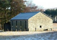 The former locomotive shed at Dolphinton (NB), looking east from the A702 in December 2003. The LL&D line south from Broomlee had closed completely in 1933. [See image 7427] [Ref query 9304] <br><br>[John Furnevel 11/12/2003]