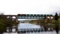 66111 heads south over the Oykel Viaduct on 1 May 2015 with the empty tank wagons from Lairg. After a long period of absence this is the second tank train in just over a week.<br><br>[John Gray 01/05/2015]