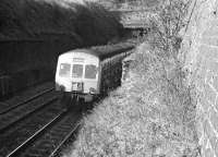 A Metro-Cammell dmu bursts out of Winchburgh Tunnel on what is probably the 15:08 Stirling - Edinburgh Waverley service, thought to be in April 1972.<br><br>[Bill Jamieson /04/1972]