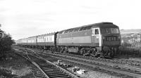 Brush Type 4 No. 1545 has rather beaten the camera as it accelerates off the Royal Border Bridge and past the junction with the Kelso line (still in the process of being dismantled) at Tweedmouth on Saturday 19th September 1970. 1E15 was a dated SO relief to the 10:30 Aberdeen - Kings Cross, departing Edinburgh 15 minutes ahead of it at 13:45, and should have run for the last time a fortnight earlier, but has been reinstated in anticipation of heavy traffic in connection with the Edinburgh Festival.<br><br>[Bill Jamieson 19/09/1970]