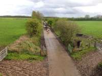 We could speculate about the possible future reopening of the Waverley route from Tweedback through to Carlisle till the cows come home but... <I>hang on a minute... well I never - would you look at that!</I> View towards Carlisle from a road bridge less than a mile to the south of Longtown on 6 May 2015, with this section of the Waverley trackbed having recently been concreted over.<br><br>[Bruce McCartney 06/05/2015]