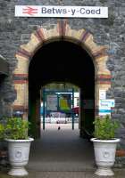 A tantalising glimpse of a 'real' train through the station entrance at Betws-y-Coed on 14 April 2015 proves to be the static coach used as a tearoom in the Conwy Valley Railway Museum.<br><br>[Colin McDonald 14/04/2015]