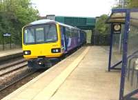 <I>'Would all passengers please lean to the right...'</I> 144023 breezes into Elsecar with a Sheffield service on 4 May. The 1897 former station building is out of sight to the right.<br><br>[Ken Strachan 04/05/2015]