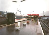I've always believed Fort William to be the wettest town in Britain, but it's hard to verify this, though it certainly rains a lot. In October 1997 stock for the London sleeper awaits its loco - in the rain.<br>
<br><br>[David Panton 06/10/1997]