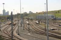 Afternoon grab shot of the Queens Road Metrolink Depot from a passing Bury line tram in April 2015. The line on the far left is the access from the Rochdale line. Beyond the depot the old trackbed continues down to Manchester Victoria through the site of the well known Red Bank carriage sidings. <br><br>[Mark Bartlett 20/04/2015]