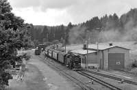 Metre gauge 2-10-2T 99 7245 eases its train, the 14:36 departure from the Brocken to Nordhausen, into Benneckenstein on 19 July 2008. Photographed from the roof of the goods shed (only accessible for a brief period from scaffolding while David Spaven and myself were painting the outside of the adjacent station building), the engine shed features prominently on the right hand side. This brick built structure dating from the 1980s, had replaced an earlier half-timbered construction which went up in flames one night in June 1982 in an incident involving the then oil-fired 99 7232 and a well oiled fireman! At that time the shed was still in use for stabling one loco overnight but by the date of the photograph in 2008 it was only utilised for storing surplus locos.<br><br>[Bill Jamieson 19/07/2008]